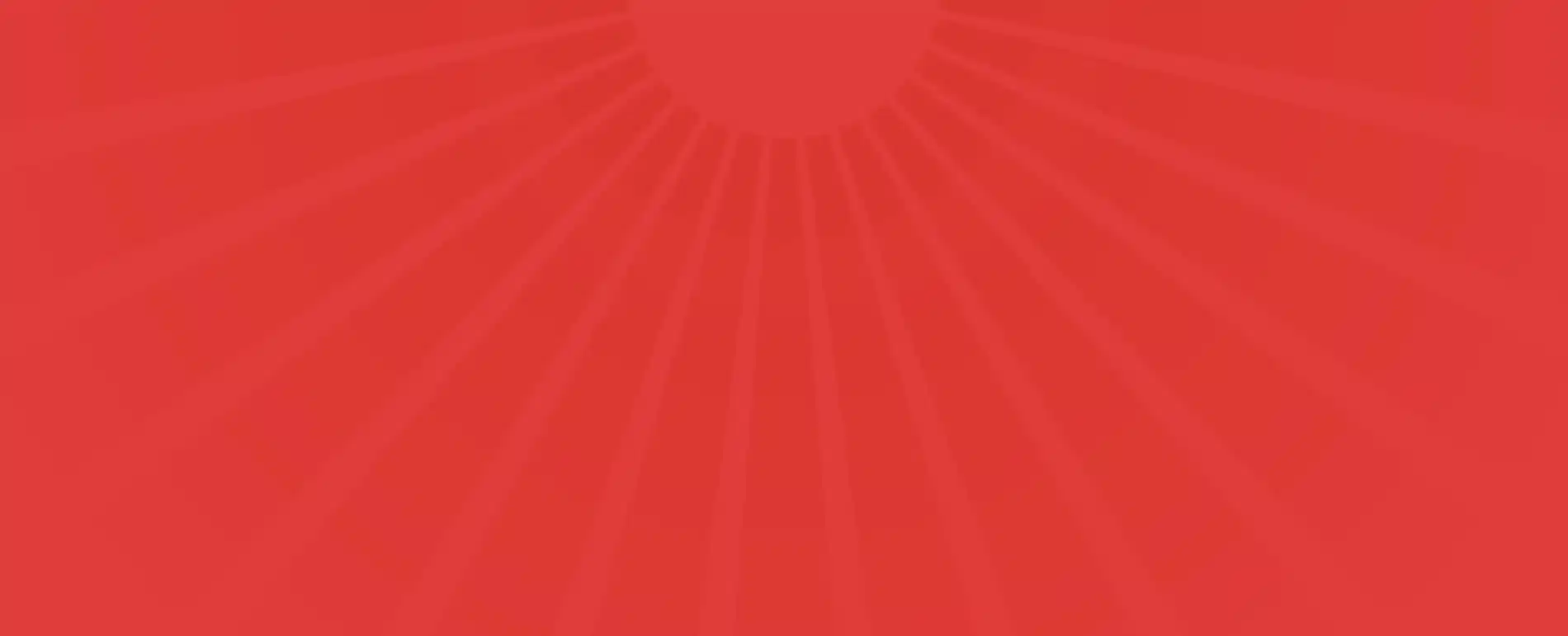 Bright red sun with spreading rays overlaying a darker red background